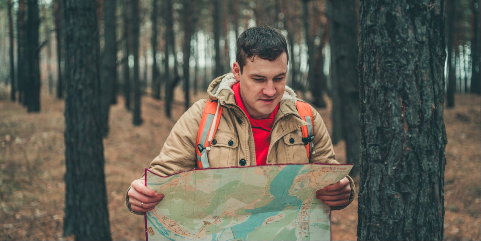 camping tips article - lost hiker with map